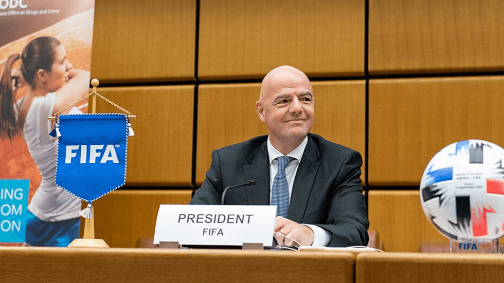 A bald man at a desk