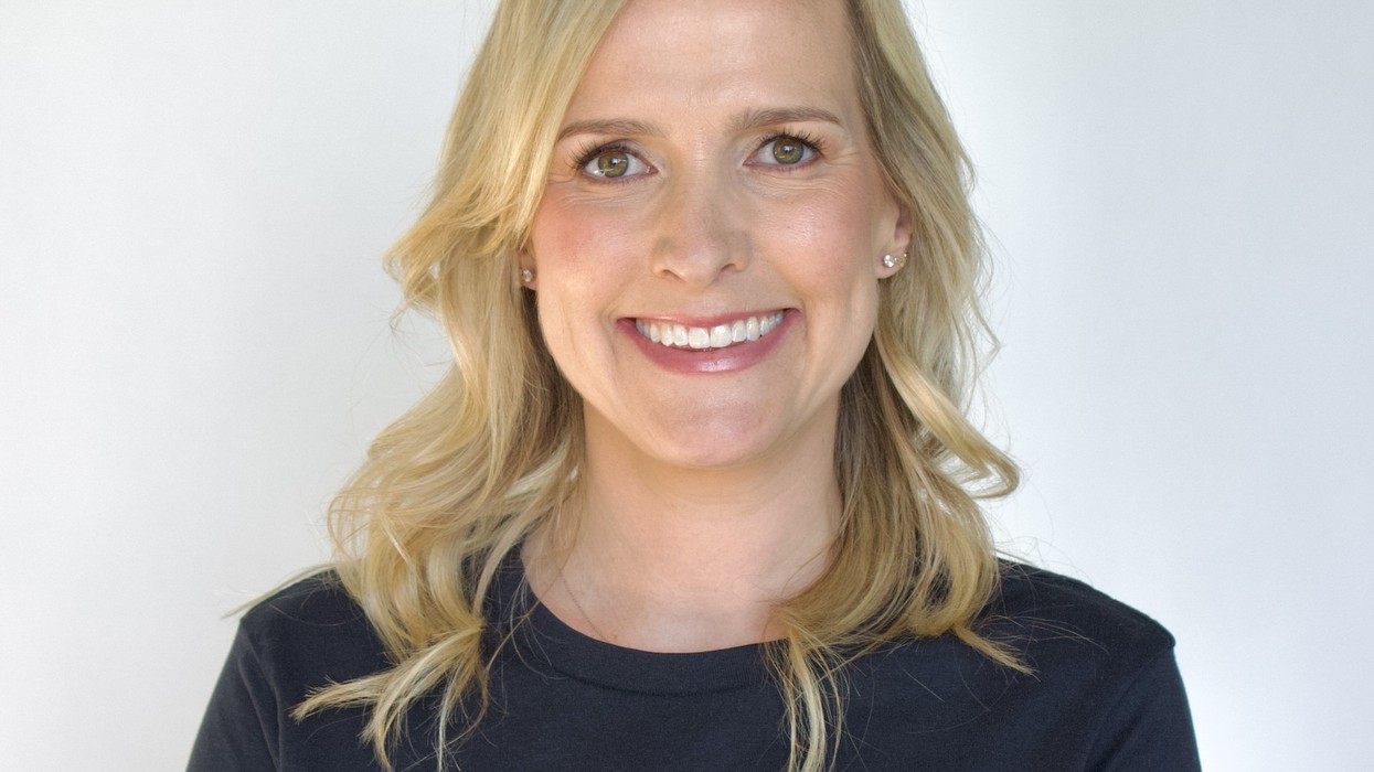 A blond woman wearing a t-shirt saying Tribal