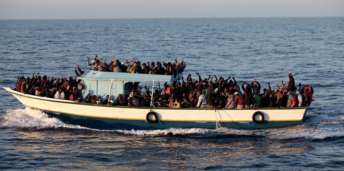 A boat with lots of people onboard