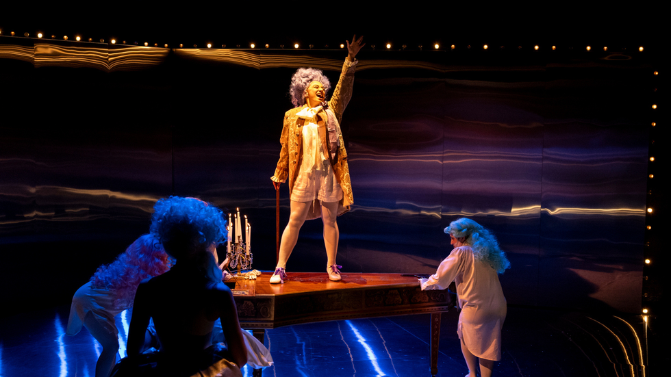 A character stands on a grand piano 