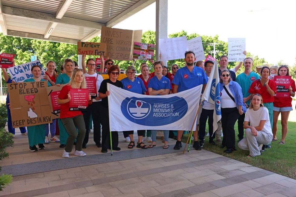 A crowd of nurses and midwives protesting