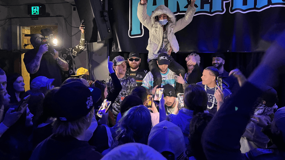 A dance party with people holding cameras