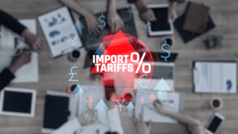 A desk with a superimposed graphic saying import tariffs