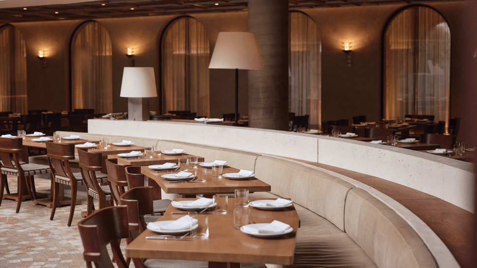 A dining room with a row of tables