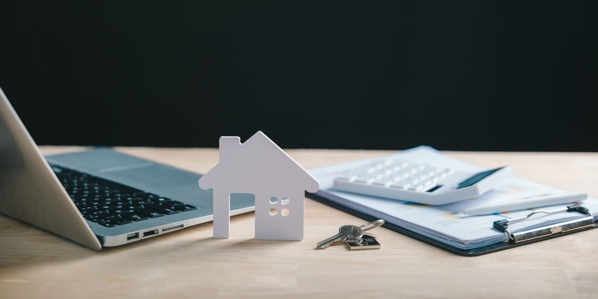 A keyboard, keys, a clipboard and a small house