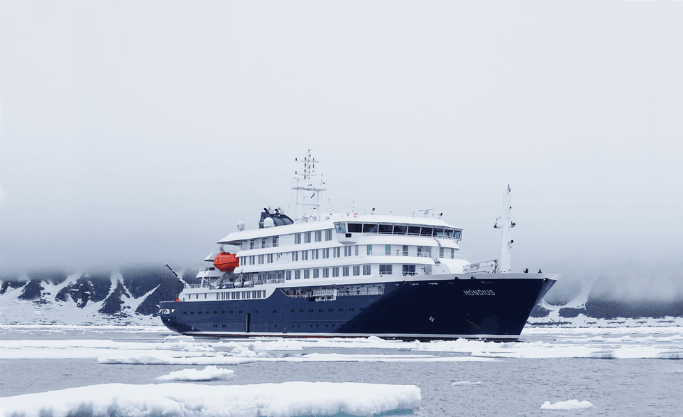 A large ship cutting through icy waters