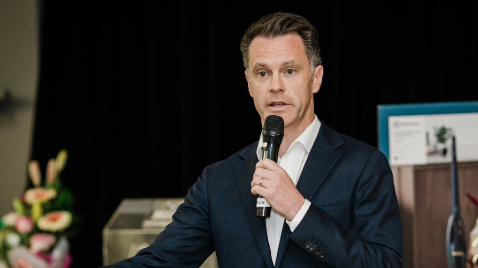A man holds a microphone 