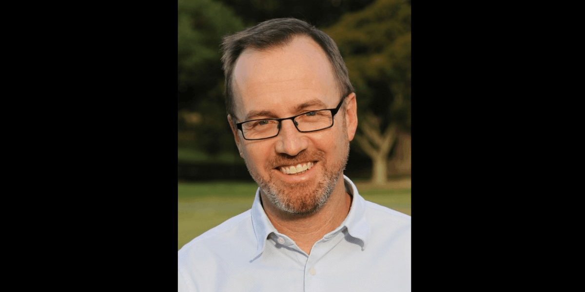 A man in a blue shirt
