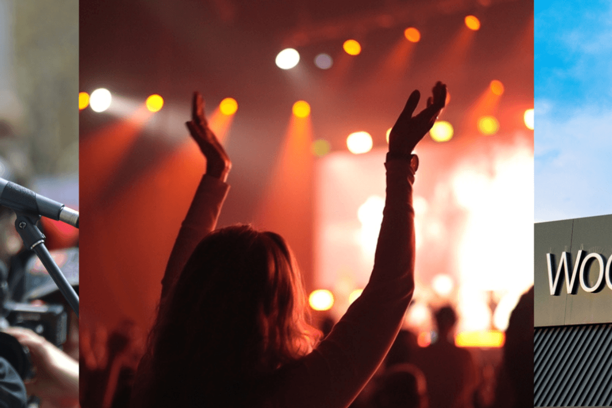 A man in a suit, a girl in the audience at a concert, the Woolworths banner