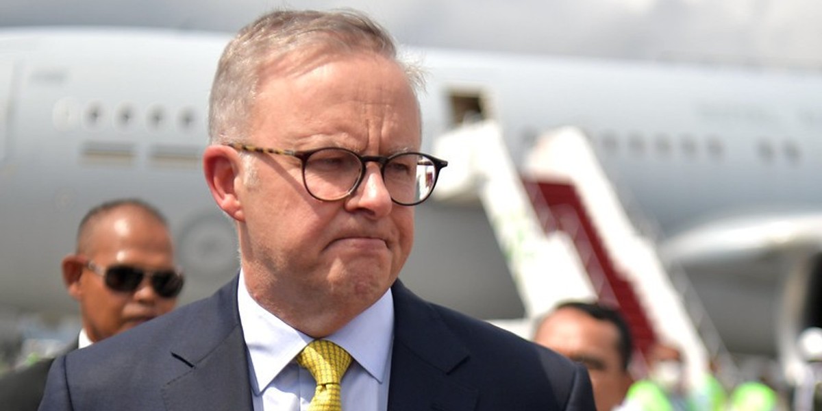 A man in glasses and a yellow tie