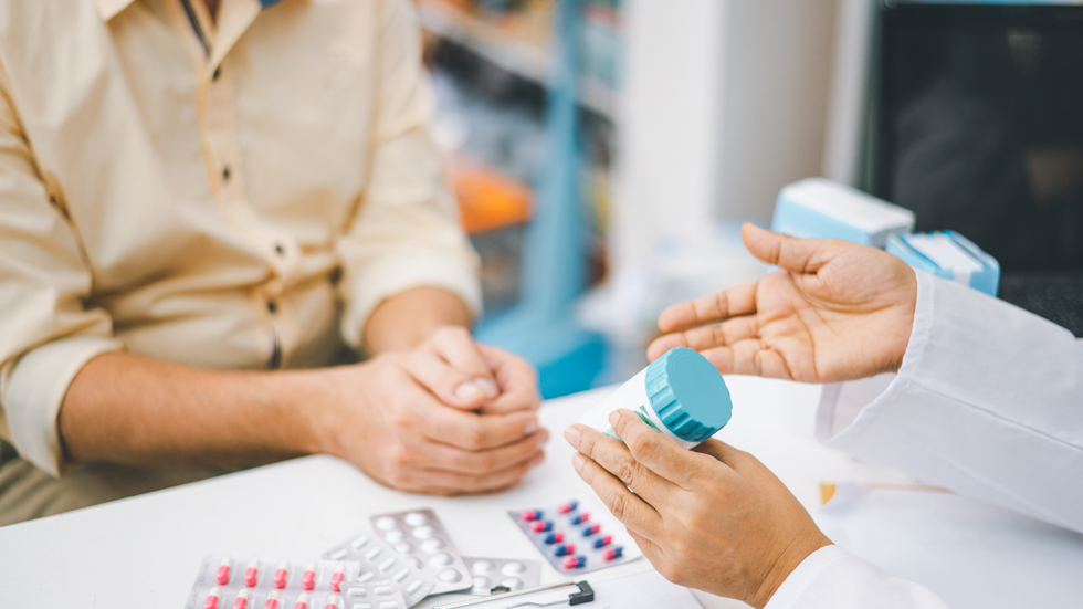 a man speaking to a doctor about prescribed pills