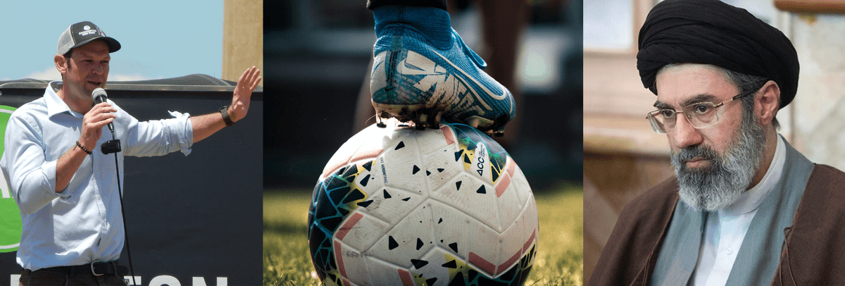 A man standing with a microphone, a foot on a football and a grey haired Iranian cleric 