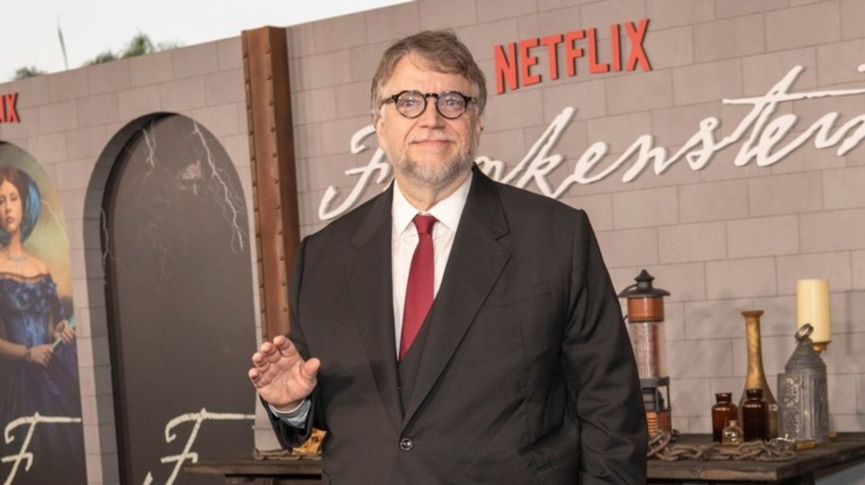 A man wearing a suit and red tie at the preview of Netflix's screening of Frankenstein