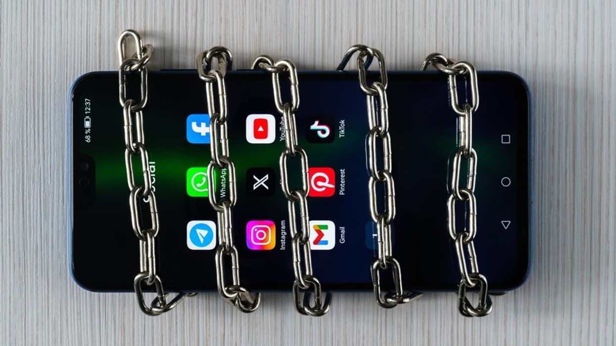 A mobile phone with apps in a chain