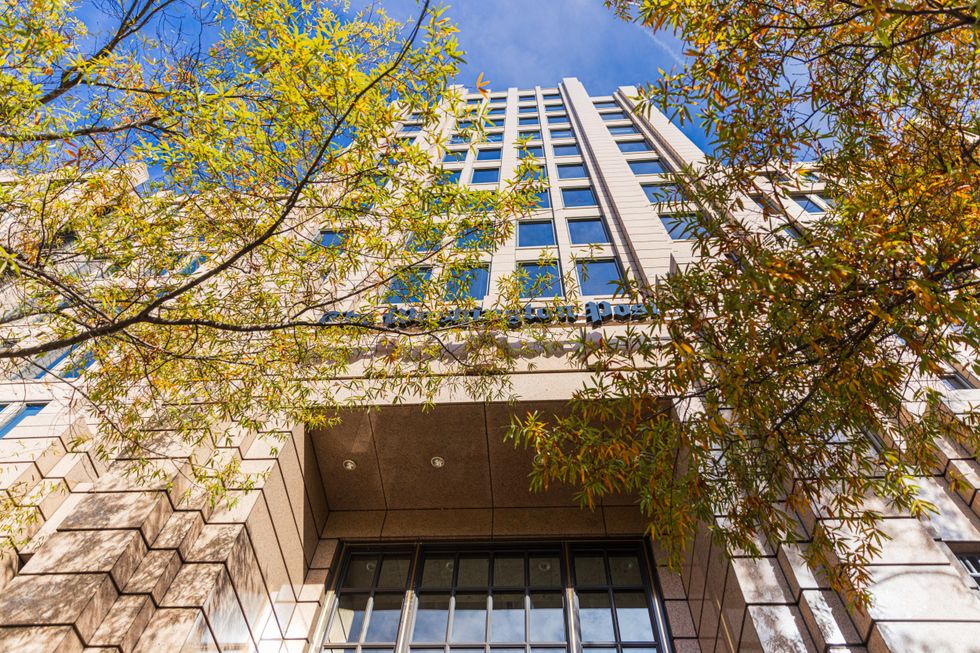 A picture of the skyscraper building taken from the ground up