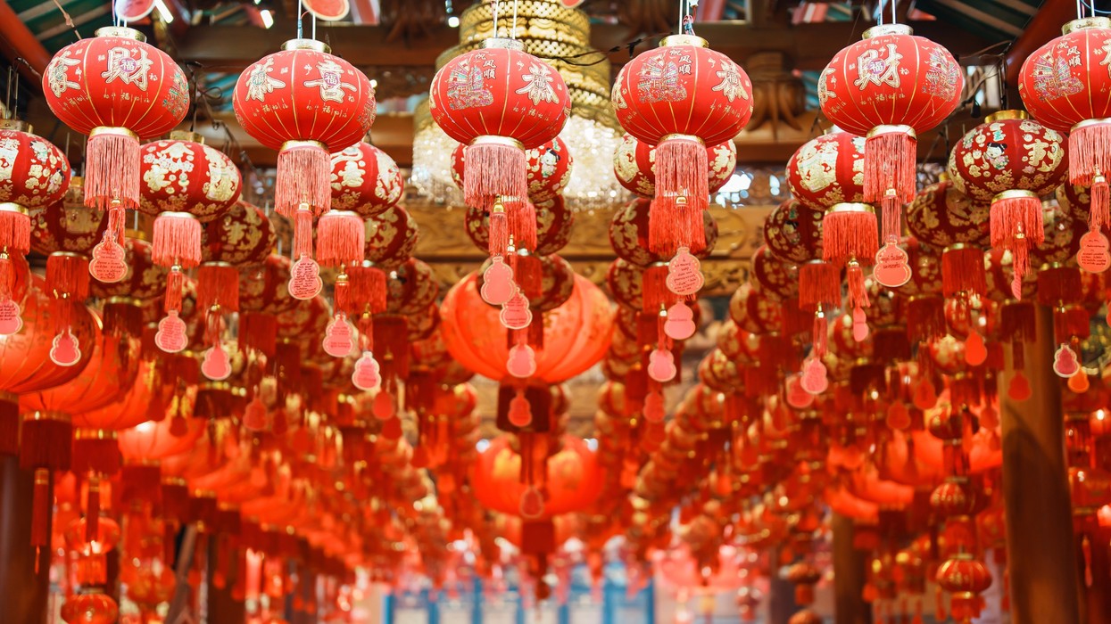 A walkway filled with red lanterns
