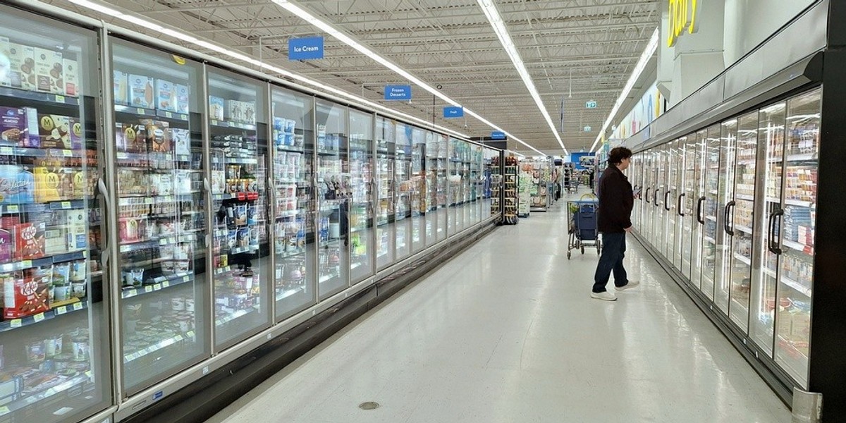 A wide shot of supermarket fridges
