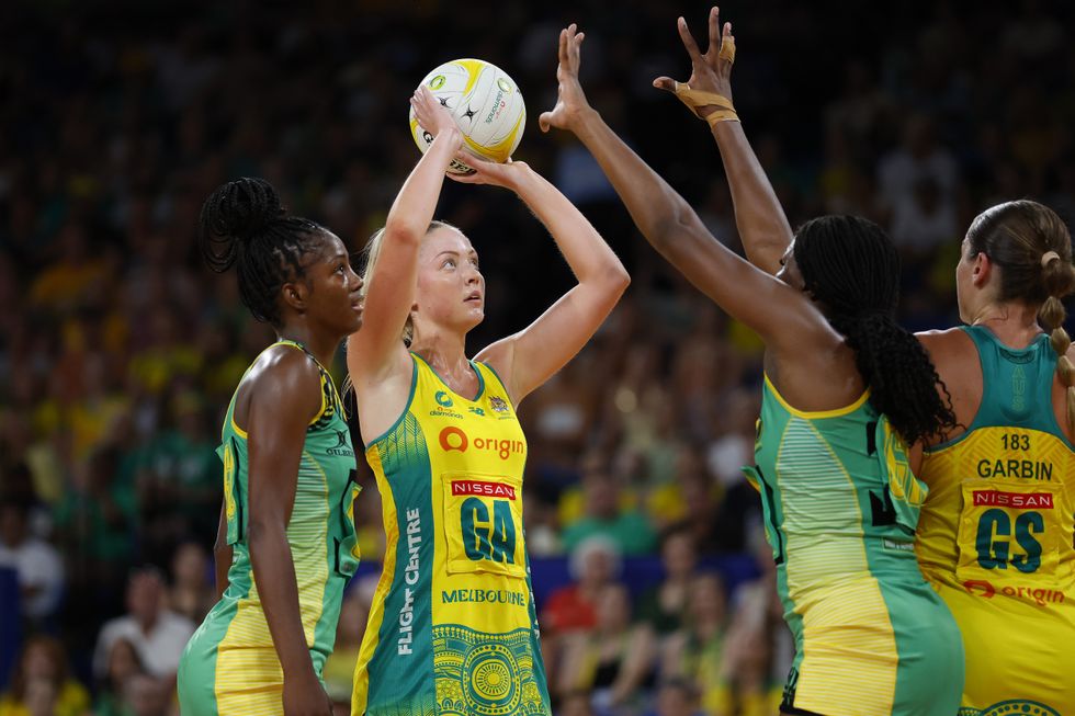 A woman shoots for the goal