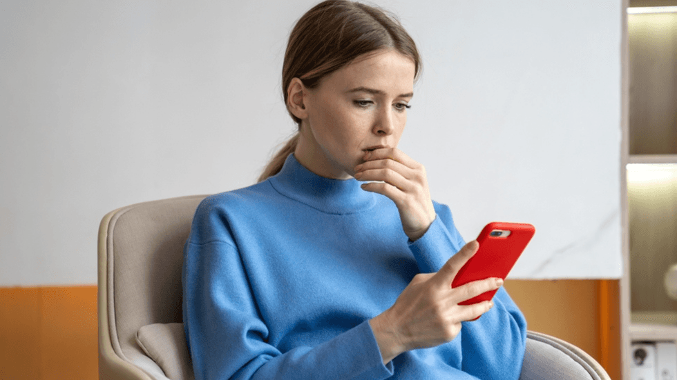 A young woman looking at her phone