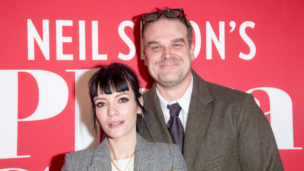Actress and singer Lilly Allen with actor David Harbour posing for a photo