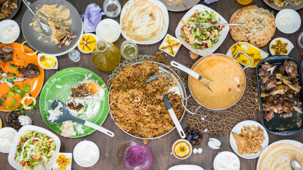 An overhead view of a cafe table groaning with foo