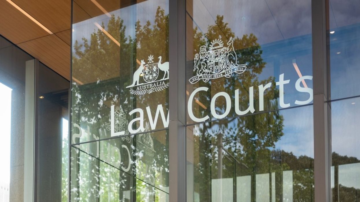 Exterior of glass-fronted building with Law Courts emblazoned on it.