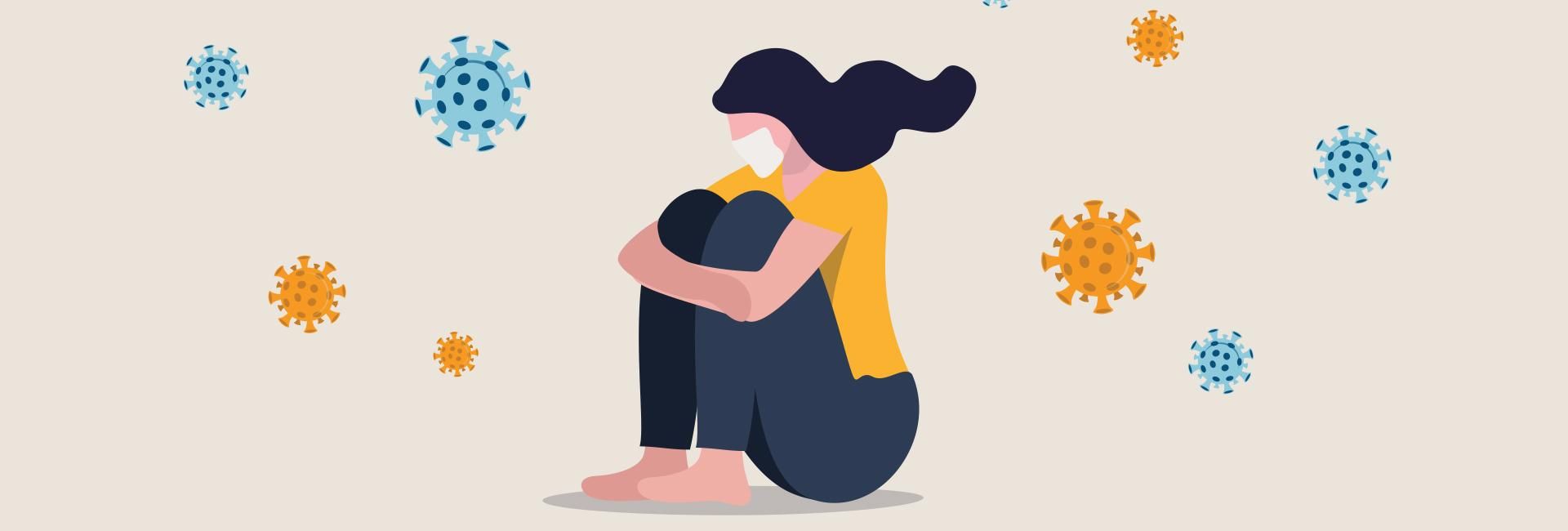 Illustration of a masked young woman sitting down with her arms wrapped around her raised knees. She is surrounded by floating COVID viral symbols.