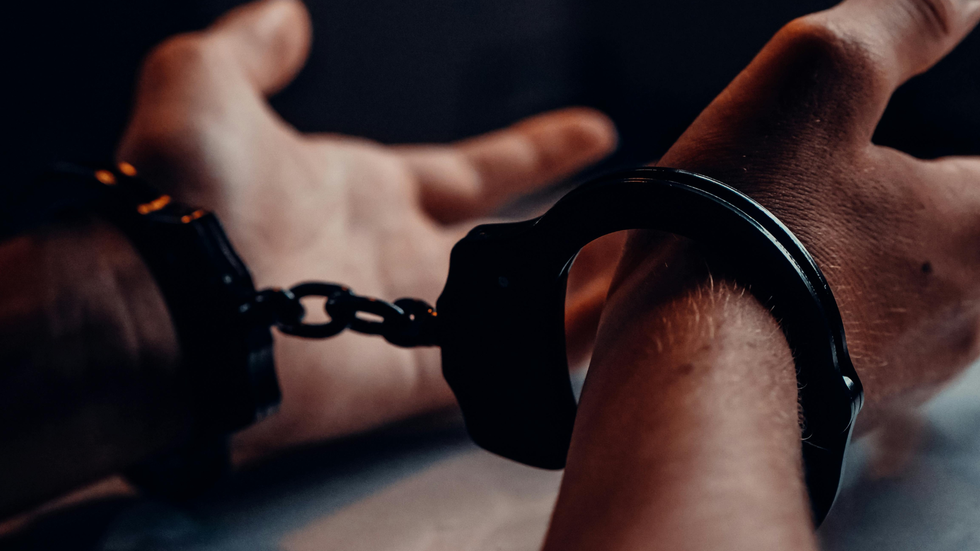 image of person in handcuffs