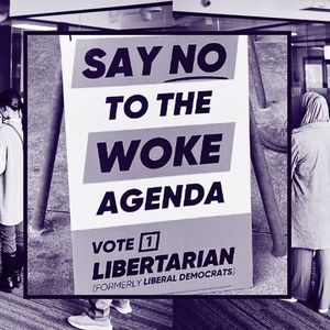 People lined up waiting to vote on election day, queuing before a man waiting at a desk to hand them a ballot