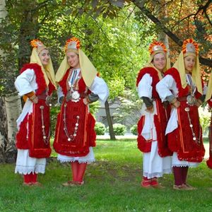 Line of young girls in traditional Macedonian cultural dress.