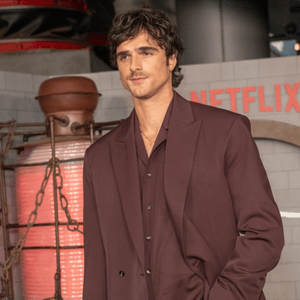 Three images of actors including two men in suits and a woman in a lacy dress.