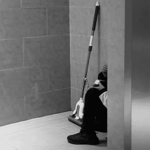 Three black and white images showing cleaners at work