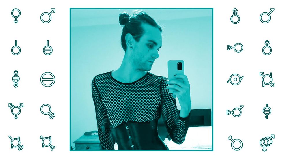 Selfie image of Kyle Dean dressed in a fishnet top.