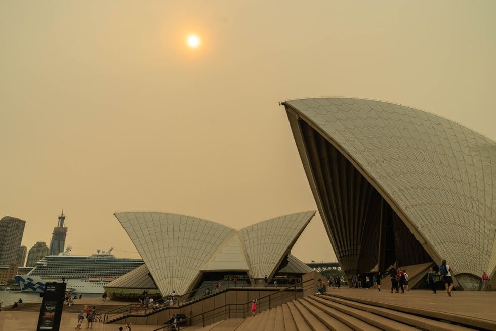 Sydney Opera House blanketed by smoke and an eerie sun
