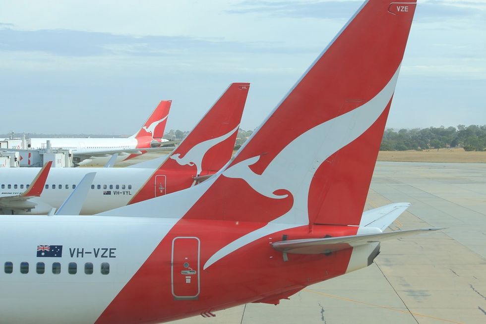The tail of a Qantas airplane with red kangaroo branding