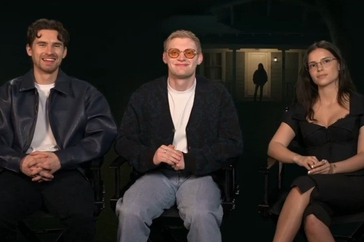 Two men and a woman sit in interview chairs