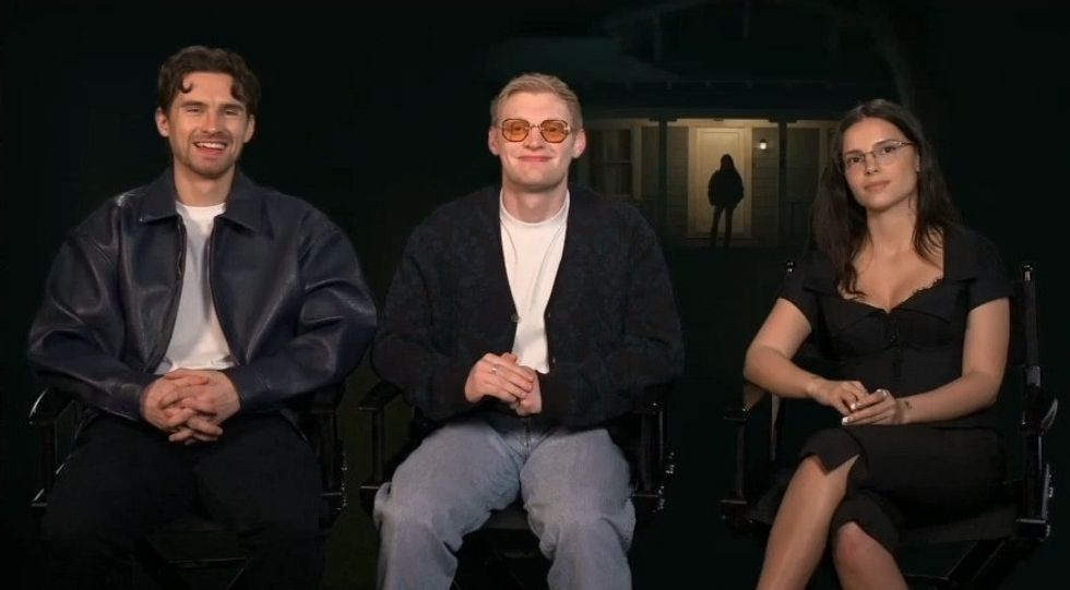 Two men and a woman sit in interview chairs
