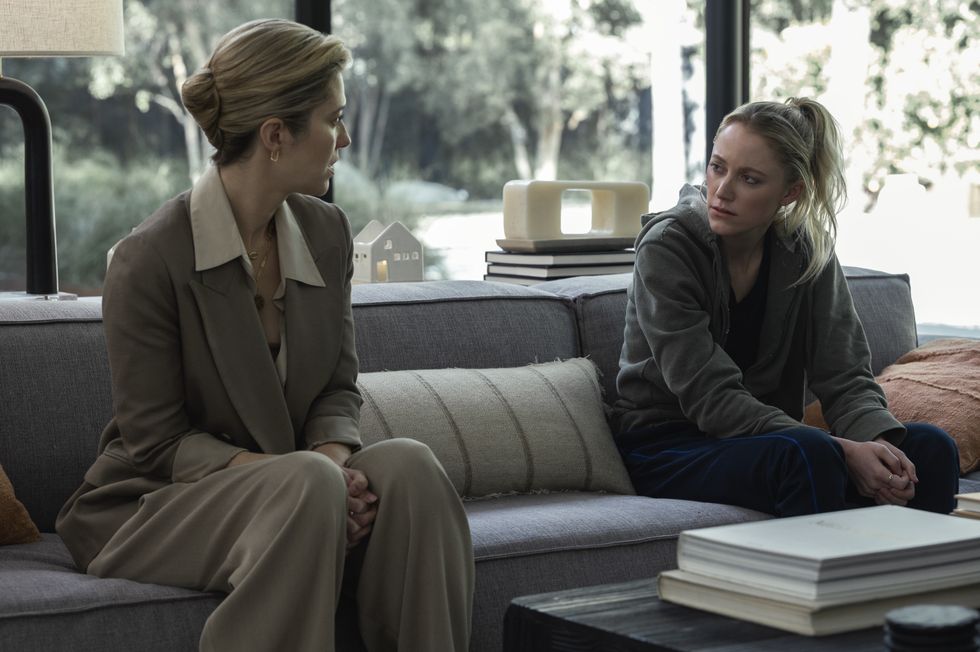 Two women sitting on a couch